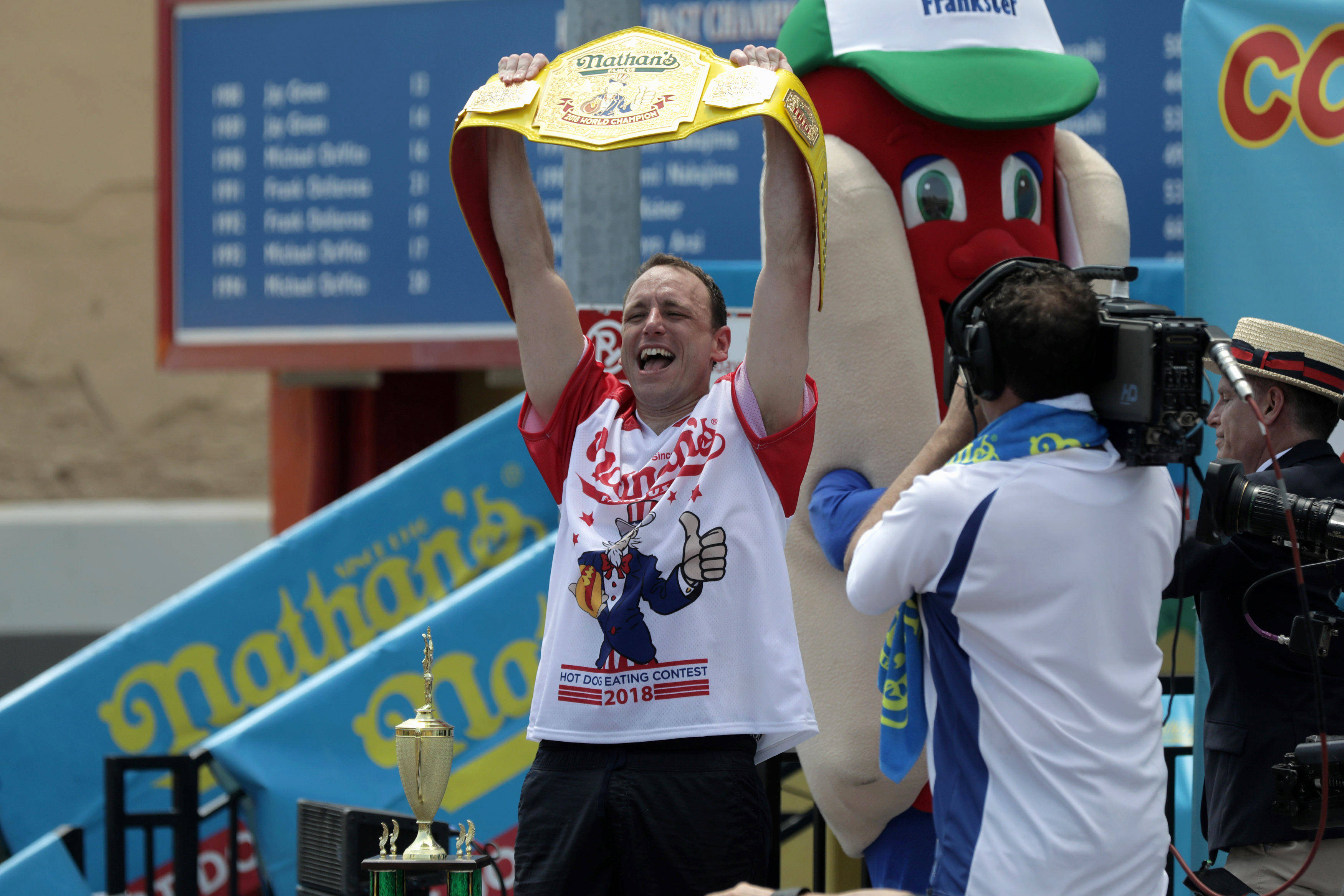 Joey Chestnut wins the annual Nathan's Hot Dog Eating Contest, setting a new world record by eating 74 hot dogs in Brooklyn, New York City